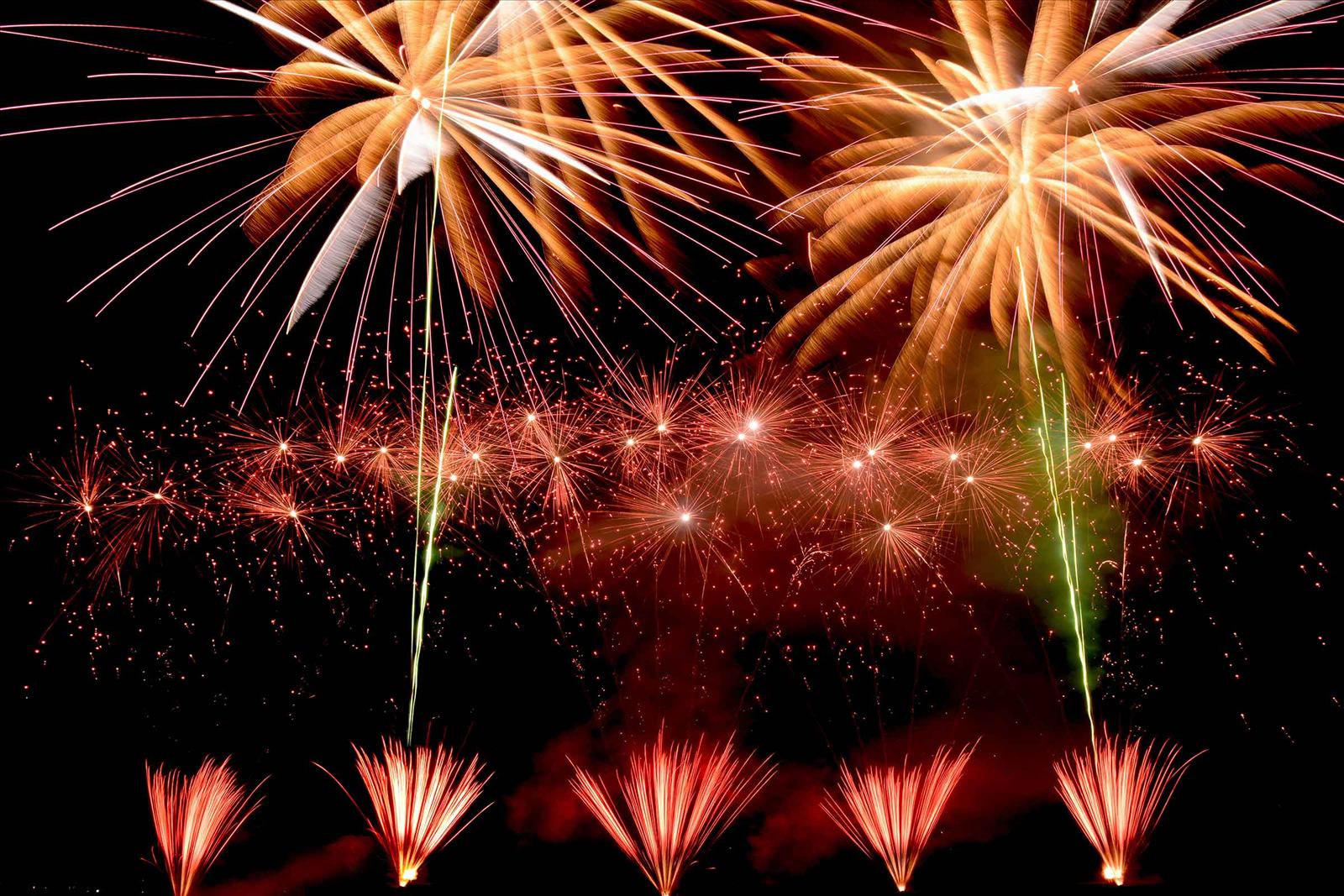 Wedding guests watching a choreographed firework display